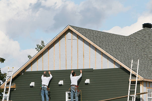 Professional Vinyl Siding technician working in Newton, MA
